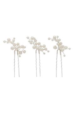 These hair pins turn your big-day 'do into a luminous work of art with gorgeous clusters of imitation pearls that are hand wired in 14-karat-gold plate. Set of three hair pins 2" each Lead-free; nickel-free; cadmium-free Sterling silver with 14k-gold plate/imitation pearl Made in the USA of imported materials Item ships in a gift box Pearl Hair Accessories, Bride Hair Pins, Bride Hair Piece, Hair Accessories Pearl, Summer 2025, Wedding Summer, Wedding Hair Pins, Pearl Hair, Wedding Hair Pieces