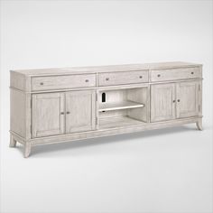 a large white entertainment center with drawers and shelves on one side, an open shelf to the other