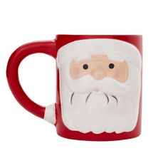 a red and white coffee mug with a santa clause on it's face in front of a white background