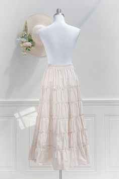 An elegant-yet-versatile skirt perfect for mixing-and-matching, the 100% cotton Antoinette skirt in cream features tiers accented with ruffles, a comfortable elastic waistline, and flowy silhouette made for twirling! . Details: S: Waist 26"-32", Length 35" M: Waist 28"-34", Length 35.5" L: Waist 30"-36", Length 36" Elastic Waistline Material: 100% Cotton Unlined Care: Hand Wash Cold / Hang Dry Imported Ships in 1 to 2 Business Days Free US Shipping on Orders over $100 Cottagecore Skirt Outfit, Outfit Basics, Cottagecore Skirt, Cream Skirt, Cottagecore Outfits, Cotton Midi Skirt, French Girl Style, Skirt Outfit, Basic Outfits