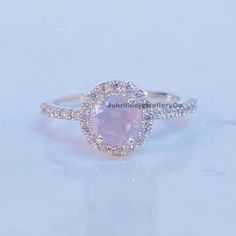 "Snowflake Rose Quartz Ring-Round Shaped-Gold Ring-Silver Ring-Delicate Ring-Stacking Ring-Promise-Anniversary Ring for Women-birthday Gift Specifications :- ❥ Stone - Natural Rose Quartz ❥ Stone Size - 6x6mm  ❥ Cut Type - Round ❥ Side Stones- Simulated diamonds Cz ❥ Ring Size: I offer more than one (Contact us if your ring size is not available in the listing) ❥ Color: Silver, Gold, Rose Gold, White Gold or Black Rhodium ❥ Material : 925 Sterling Silver, 14K/18K/22K Solid Gold --> ❥ Makes a Wonderful Gift for your Girlfriend, Wife, Mother and Friend or Simply an Excellent Addition to Your Jewelry Collection -->IF YOU WANT CUSTOM ENGRAVING ON YOUR RING VISIT OUR LISTING HERE: It's Only 2 USD https://www.etsy.com/listing/1436332485/custom-engaraving - -Here's a link to my HOMEPAGE: Johrifin Delicate Promise Jewelry With Halo Setting, Silver Halo Birthstone Ring Fine Jewelry, Dainty Cluster Ring With Halo Setting, Silver Halo Crystal Ring As A Gift, Silver Halo Birthstone Ring For Wedding, Sterling Silver Rose Gold Ring With Halo Design, Anniversary Crystal Ring With Halo, Silver Halo Design Rings As A Gift, Silver Rings With Halo Design As Gift