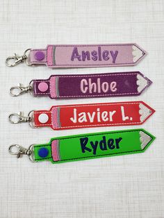 "Personalized Name Tag, customized name key fob, embroidered keychain, back to School, luggage Tag, backpack Label, Backpack Name, Backpack Name Tag for Kids, Teacher Gift. This pencil snap name tag can be personalized with any font color and 1 name or 3 initials. This tag is made from Vinyl. Please leave the name and font color you would like to be embroidered in the \"notes to seller\" during checkout. The embroidered pencil measures approximately 7.25 x 1.25 inches including the swivel clip. Backpack Name Tags, Name Tag For Kids, Mopping The Floor, Custom Bag Tags, Baby Boy Crib Bedding, Suitcase Tags, Personalized Stuffed Animals, Embroidered Backpack, Space Themed Nursery