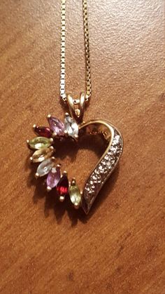 This is a gorgeous vintage sterling silver gold overlay multistone heart pendant on an Italian sterling silver gold overlay necklace. The pendant has aquamarine, amethyst,  red garnet, peridot, and citrine gemstones. The pendant and necklace are both in excellent vintage condition. The pendant measures 1 inch high by 1/2 Inch wide and the necklace measures 18 inches long. Marked Italy 925. Heart Cut Jewelry For Valentine's Day Collectibles, Heart Cut Collectible Jewelry For Valentine's Day, Collectible Heart Cut Jewelry For Valentine's Day, Vintage Gemstone Heart Pendant Necklace, Multicolor Hallmarked Necklace For Anniversary, Yellow Gold Multi-stone Jewelry For Valentine's Day, Heart Cut Jewelry With Gemstone Accents For Gift, Heart Cut Gemstone Jewelry For Gift, Heart Gemstone Jewelry For Crafting