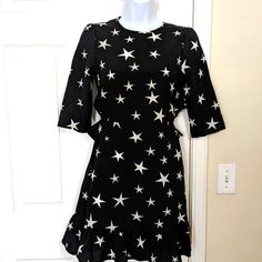 Avantlook Mini Dress. Black With White Stars. Size S. Zipper On Side. Open Back. 18 In From Waist To Knee Black Star Print Dress For Spring, Spring Black Dress With Star Print, Black Dress With Star Print For Spring, Black Mini Dress With Star Print, Star Dress, Mini Black Dress, Mini Dress, Stars, Womens Dresses