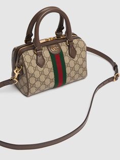 Height: 14cm Width: 21.5cm Depth: 11.5cm. Detachable strap,Drop: 52cm. Double top handles,Drop: 9cm. Top zip closure. Logo details. Chevron quilted front and back. Gold-colored metal hardware. Fabric lining Gucci Mini, Gucci Tote Bag, Versace Brand, Gucci Ophidia, Gucci Tote, Ski Accessories, Chevron Quilt, Canvas Shoulder Bag, Quilted Bag