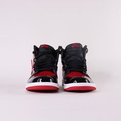 Debuted in 1985, the Air Jordan 1 Patent Bred offers a rendition to the iconic classic. Released December 30th, 2021. * Encapsulated Air Sole * Genuine patent leather in the upper offers durability * Air Jordan ball and wings logo on side * Black toe colour blocking Size and Fit* Fits true to size Leather Jordan Shoes With Laces For Streetwear, Streetwear Jordan Shoes With Lace-up Design, Jordan Lace-up Shoes With Boost Midsole For Streetwear, Nike Custom Sneakers For Streetwear With Branded Insole, Nike Custom Sneakers For Streetwear, Nike Streetwear Custom Sneakers, Nike Lace-up Streetwear Sneakers, Leather Jordan Lace-up Shoes For Streetwear, Leather Jordan Shoes For Streetwear