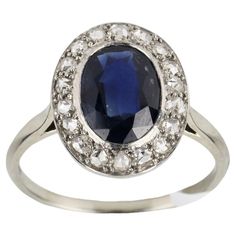 an oval blue sapphire and diamond ring