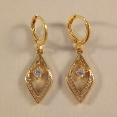 Light Gold Earrings, Dangling Gold Earrings, Gold Prom Jewelry Earrings, Yellow Gold Plated Earrings For Formal Occasions, Yellow Gold Plated Formal Earrings, Lever Back Earrings, Formal Yellow Gold Plated Earrings, Gold Lever Back Cubic Zirconia Earrings, Yellow Gold Plated Party Earrings