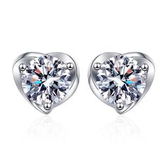 These Four Claw Heart Moissanite Stud Earrings feature a timeless design that will sparkle for generations. Crafted with four claws, this setting ensures maximum durability and brilliance while the heart cut enhances the fiery luster of the Moissanite. Perfect as a gift. Product Details: Material: 925 Sterling Silver Stone: Moissanite Diamonds/D /0.5 carat Weight: about 1.75g Size: 5mm SKU: AE23110319 Keywords: moissanite earrings, moissanite stud earrings, moissanite earrings studs, moissanite Diamond White Round Cut Earrings For Valentine's Day, Classic Round Brilliant Cut Heart Earrings, Classic Diamond White Earrings For Valentine's Day, Heart Cut Cubic Zirconia Earrings With Prong Setting, Classic Round Cut Diamond Heart Earrings, Classic Heart Earrings With Brilliant Cut, Classic Heart-shaped Diamond Earrings With Vvs Clarity, Diamond White Heart Earrings With Brilliant Cut, Classic Heart Earrings With Prong Setting