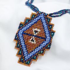 Trendy and tribal-inspired, the Mayan Pyramid Beaded Pendant Necklace makes a bold statement. Perfect for pairing with whites or denim for a great boho look. Made by women artisans of La Casa in Guatemala. Since 2000, La Casa Cotzal has designed a range of Guatemalan handcrafted pieces produced by artisan communities throughout the country. Mayan women traditionally have been backstrap loom weavers, but increasingly they are learning to use pedal looms as well. In traditional Guatemalan weaving, the two main specialized techniques are ikat and supplementary weft brocade. Artisans at La Casa are versed in both weaving techniques as well as in intricate bead work. The work provided by La Casa is vital to the women's families and communities. Glass beads & cotton thread Pendant: 3.25" H x 2" Adjustable Southwestern Style Handwoven Necklace, Traditional Ceremonial Beaded Pendant Necklaces, Multicolor Handwoven Southwestern Necklaces, Southwestern Handwoven Beaded Necklace, Mayan Necklace, Guatemalan Weaving, Mayan Women, Backstrap Loom, Spirit Clothing