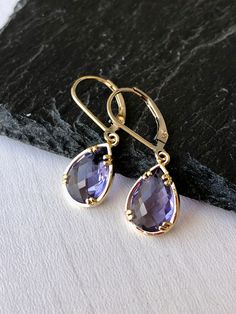 Amethyst Earrings, February Birthstone, Purple Teardrop Gem Earrings in Gold or Silver, Purple Jewelry, Lavender Earrings, Gift for women These small but gorgeous earrings feature deep purple amethyst teardrops bezel framed in either 14k gold filled or sterling silver. The teardrops are suspended form lever back ear wires in the finish of your choice. These are small, delicate and dainty earrings but with a gorgeous lavender color sure to match many outfits. Ideal for a girl or a women that like Lavender Drop Earrings For Formal Occasions, Lavender Dangle Earrings For Formal Occasion, Drop Earrings With Birthstone For Jewelry Making, Elegant Drop Earrings With Birthstone, Elegant Purple Hypoallergenic Earrings, Teardrop Birthstone Earrings For Jewelry Making, Purple Teardrop Drop Earrings For Formal Occasions, Purple Drop Teardrop Earrings For Formal Occasions, Birthstone Drop Earrings For Jewelry Making