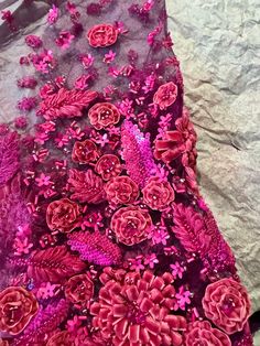 a piece of cloth with pink flowers on it