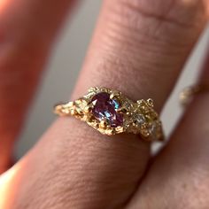 "This Juniper Cluster Ring features a shimmering purple, pear cut alexandrite set asymmetrically amongst a cluster of diamonds. The rustic and textured band is molded from an Ashe Juniper tree. 100% recycled gold  100% lab grown diamond & alexandrite Every single ring in my collection is designed, sculpted and produced entirely by hand. I never use computers and I never use \"off-the-shelf\" designs that you see in so many jewelry stores. Each ring begins by casting an actual twig or piece of ba Asymmetrical Gold Ring, Unique Engagement Rings Art Deco, Bee Engagement Ring, Fairy Style Engagement Ring, Vintage Ring Engagement, Freeform Engagement Rings, Organic Gold Engagement Ring, Eclectic Rings Engagement, Eclectic Engagement Ring