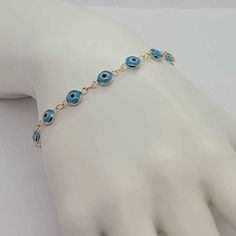 Experience The Beauty Of This Brand New Brazilian 18k Gold Filled Baby Blue Evil Eye Bracelet! Surround Yourself With Protection As You Wear This Luxurious Piece Crafted With 18k Gold-Filled And A Beautiful Baby Blue Evil Eye. With A Length Of 7 Inches And An Included Jewelry Bag, This Bracelet Will Stay Looking Like New For Years, Never Tarnishing With Proper Care. Make A Statement And Shine With This Exquisite Bracelet Today! Elegant Adjustable Blue Gold Bracelet, Elegant Blue Adjustable Gold Bracelet, Blue Gold Plated Bracelet Jewelry, Blue Gold Plated Bracelet, Adjustable Blue Gold-plated Jewelry, Blue Round Gold Bracelet For Gift, Blue Gold Plated Jewelry For Party, Blue Hypoallergenic Jewelry For Party, Hypoallergenic Blue Jewelry For Party