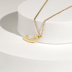 This stunning necklace features a beautifully crafted pendant with a personalized Arabic letter. The elegant design of the letter captures its unique and intricate beauty, making it a focal point of sophistication and charm. The pendant hangs from a delicate chain, perfect for adding a touch of elegance to any outfit. Ideal for everyday wear or special occasions, this necklace makes a meaningful and stylish statement. It also serves as a thoughtful and personalized gift for loved ones, celebrati Engraved Initial Pendant Chain Necklace As Gift, Engraved Initial Pendant Chain Necklace For Gifts, Formal Initial Pendant Necklace With Clavicle Chain, Formal Personalized Initial Pendant Necklace, Personalized Pendant Chain Necklace For Gifting, Initial Pendant Name Necklace With Adjustable Chain As Gift, Initials Pendant Chain Necklace As Gift, Initial Pendant Chain Necklace As Gift, Minimalist Initial Pendant Chain Necklace Gift