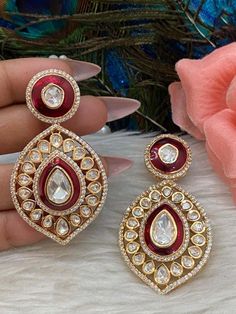 Gold Finish polki kundan studded earrings with beautiful red resin detailing. Ethnic Festive Statement Earrings.  Light weight earrings.  💥Premium Quality  💥Super Trendy 💥Statement Earrings 2.5" Long.  WHAT GOES IN  👉🏻High Quality raw materials, brass is used as base metal. ✅Check our collection here https://www.etsy.com/shop/KKsCulture ✅Send us an email if you need help! kksculture @ gmail.com | Contact Us 732-325-2222 Studded Earrings, Polki Earrings, Kundan Earrings, Earrings Red, Wedding Jewelry Earrings, Light Weight Earrings, Wedding Earrings, Base Metal, Red Gold