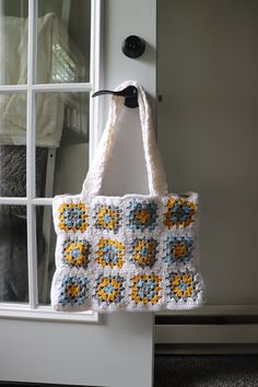 Handmade Crocheted Granny Square Tote Bag -  Buy it for yourself or gift it to a loved one! Perfect for shopping, the beach, going to the market or other misc. activities. Great for all four seasons to match with a boho look of your choice. Bag is approximately ~15.75in x ~12.5in. Includes a grey and white checkered fabric lining inside of tote. This bag is soft, yet durable. The straps are made with a double layer of yarn to ensure durability. Colors include mustard yellow, grey, light blue, and white for a beautiful, subtle look with a hint of color. Washing Instructions: Hand wash gently and lay flat to dry. This bag is already made and ready to ship! Thank you for visiting my shop, and please contact me for any questions :) Handmade Rectangular Crafts For Everyday Use, Granny Square Tote Bag, Granny Square Tote, Lake Villa, Checkered Fabric, Retro Farmhouse, Medium Bag, Boho Purses, Crochet Tote