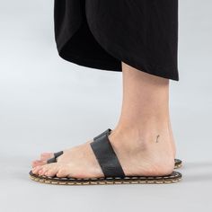 Introducing the Black Barefoot Thong Sandals - the perfect addition to your summer wardrobe. Handmade in Turkey with 100% natural materials, these sandals are crafted with a natural leather upper and a water buffalo leather sole, ensuring maximum comfort and breathability for your feet. With a wider toe box, your toes have enough room to spread and relax, promoting a more natural gait and posture. The "zero-drop" non-elevated heel helps maintain proper posture as well. Available in sizes ranging Women's Slip Ons, Proper Posture, Water Buffalo, Barefoot Shoes, Buffalo Leather, Ballet Flat Shoes, Slipper Boots, Kids Boots, Mens Slippers