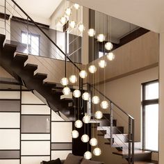 a living room filled with furniture and a spiral staircase