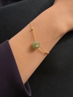 Better roll up your sleeves, cuz this ain’t no average skinny bracelet. Our bestselling Coin bracelet features a hollow round shape in green lab nephrite and an adjustable skinny chain in gold-plated sterling silver. Weight: 2g Adjustable chain: 14K gold-plated S925 sterling silver, length 165-190mm Pendant: Lab nephrite, diameter 12mm x thickness 5mm Green Jade Jewelry, Diy Gold Bracelets, Jade Bracelet Bangles, Jade Accessories, Thailand Jewelry, Jade Bead Bracelet, London Jewelry, Jade Jewellery, Lehenga Red