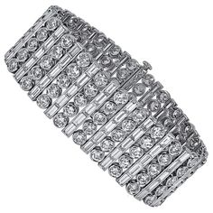 This bracelet is designed with 115 pieces of baguette cut diamonds with the total carat weight of 18.65 together with 115 pieces of round diamonds with the total carat weight of 21.59. Sophia D by Joseph Dardashti LTD has been known worldwide for 35 years and are inspired by classic Art Deco design that merges with modern manufacturing techniques. Expensive Diamond, White Gold Bangle, Diamond Bracelet Design, Flawless Diamond, Expensive Jewelry Luxury, Vintage Jewellery Rings, High Fashion Jewelry, Bracelets Gold Diamond, Expensive Jewelry