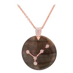 Celebrate the sign you were born under with this handcrafted Mother of Pearl and Diamond medallion. It looks great layered or on it's own as a statement piece. Try it with your favorite T-shirt for a personalized look. Available in 18 karat white, yellow or rose gold Total Diamond Carat Weight: 0.35-0.40 ctw 16 inch chain length 1.25 inch Mother of Pearl Each medallion is made to order please allow 4-6 weeks for shipping Zodiac Pendant Necklace, Zodiac Pendant, Diamond Carat, Chain Lengths, Chain Length, Or Rose, Mother Of Pearl, Zodiac Signs, White Gold