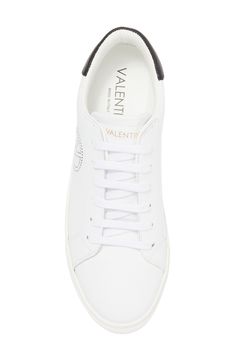 The brand's logo and a contrasting collar define a low-top sneaker shaped from smooth leather and secured with a classic lace-up closure. Leather upper/textile lining/synthetic sole Imported Designer Low-top Sneakers With Logo Detail, Classic Lace-up Sneakers With Logo Print, Classic Lace-up Sneakers With Logo, Classic Lace-up High-top Sneakers With Logo, Classic Lace-up High-top Sneakers With Logo Detail, Classic Low-top Custom Sneakers With Logo Print, Modern Lace-up Sneakers With Logo Detail, Designer Logo Lace-up Sneakers, Classic Low-top Sneakers With Logo Detail