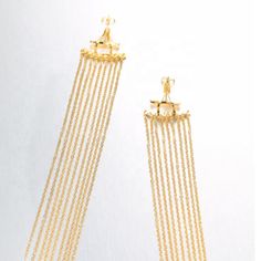 Introducing the Mila earrings, an exquisite addition to your jewelry collection that exudes elegance and sophistication. Crafted with intricate attention to detail, these chandelier dangle earrings are a true work of art that will enhance any outfit. The Mila earrings are made with high-quality materials that ensure durability and long-lasting wear. They are gold plated, adding a luxurious touch that complements the delicate design of the earrings. The width of the earrings measures .75", making Gold Plated Chandelier Earrings For Formal Occasions, Elegant Gold Plated Drop Chandelier Earrings, Elegant Long Drop Tassel Earrings For Formal Occasions, Elegant Yellow Gold Clip-on Dangle Earrings, Elegant Formal Tassel Drop Earrings, Luxury Pierced Dangle Chandelier Earrings, Dangle Clip-on Earrings Fine Jewelry, Gold Fine Jewelry Chandelier Earrings For Evening, Formal Dangle Chandelier Earrings