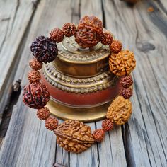 📿This unique bracelet is made from genuine sacred seeds of 2- 7 Mukhi Rudraksha. Wear this wrist seed bracelet to reap its amazing benefits.📿 2 Mukhi Rudraksha - It is also beneficial for those who are in search of the best life partner. It also helps to bring pleasure and spiritual gains to the wearer life. 3 Mukhi Rudraksha - Three Mukhi rudraksha has a soothing effect on one's mind and body. Three Mukhi Rudraksha is the form of three types of Agni (fire) and also the symbol of Three Deva i. Handmade Brown Beaded Bracelets For Ceremonial Use, Handmade Brown Beaded Bracelets For Rituals, Spiritual Brown Beaded Bracelets For Rituals, Spiritual Brown Rosary Bracelet For Meditation, Handmade Spiritual Wristband For Festivals, Spiritual Handmade Wristband For Festivals, Adjustable Traditional Bracelets For Rituals, Spiritual Brown Bracelet For Festivals, Spiritual Brown Bracelet For Rituals