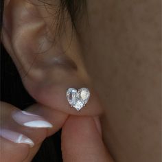 Beautiful, High Quality Silver Stud Earrings Featuring A Heart Design Made Of 3 Cubic Zirconia Stones. Sophisticated Earrings To Add Glam To Your Look And For Any Wedding Festivities. Metal Alloy With Silver Plating Overlay Highest Quality Cubic Zirconia Stones Ships Either Same Or Next Day For Speedy Delivery Single Heart-shaped Cubic Zirconia Earring, Heart-shaped Cubic Zirconia Wedding Earrings, Heart Shaped Single Cubic Zirconia Earring, Heart-shaped Single Cubic Zirconia Earring, Crystal Heart Earrings For Anniversary, Heart Cut Crystal Earrings, Crystal Heart Earrings For Wedding, Heart-shaped Cubic Zirconia Crystal Earrings For Wedding, Heart-shaped Crystal Earrings With Cubic Zirconia