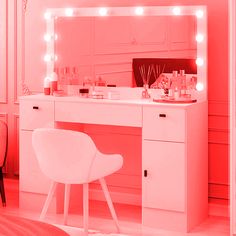 a white chair sitting in front of a vanity with lights on it and a mirror