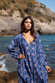 The Bella kaftan is made of light cotton silk voile and printed with vibrant florals. It has a lightweight, airy silhouette with long sleeves, button closure, and a tassel detail. This bohemian kaftan is the epitome of boho-chic style and is as elegant as it is comfortable. Printed Long Sleeve Beach Dress As Cover-up, Printed Long Sleeve Beach Dress Cover-up, Long Sleeve Boho Dress As Beach Cover-up For Spring, Long Sleeve Printed Beach Dress Cover-up, Long Sleeve Boho Dress For Spring Beach Cover-up, Hippie Long Sleeve Vacation Dresses, Long Sleeve Floral Beach Dress Cover-up, Long-sleeved Floral Beach Dress, Long Sleeve Floral Beach Dress