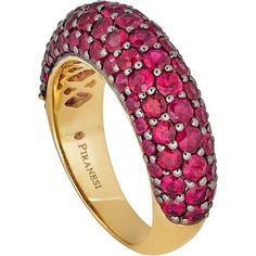 Looking for a statement piece that will turn heads? Look no further than this stunning Small Dome Ring in Ruby by Piranesi. With approximately 3.0 carats of round rubies, this ring is sure to catch the eye of anyone who sees it. The rubies are set in a unique combination of 18K yellow and black gold, creating a bold and elegant contrast that is truly one of a kind.Not only is this ring a beautiful piece of jewelry, but it also speaks to the desires of our target market. Women who buy fine jewelr Luxury Red Ring With Pave Setting, Formal Ruby Ring With Pave Setting And Round Cut, Formal Yellow Gold Ruby Ring With Pave Setting, Ruby Rings With Pave Setting, Luxury Ruby Round Cut Rings, Luxury Ruby Gemstone Ring, Luxury Ruby Ring With Multi-stone Round Cut, Luxury Multi-stone Round Cut Ruby Ring, Luxury Round Cut Multi-stone Ruby Ring