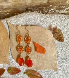 Gold filled dangle earrings with carnelian gemstones Elegant Carnelian Dangle Earrings, Carnelian Gemstone Dangle Earrings, Elegant Gold Carnelian Earrings, Orange Teardrop Gemstone Earrings, Orange Carnelian Earrings For Gift, Carnelian Dangle Earrings With Natural Stones, Orange Carnelian Dangle Earrings, Orange Carnelian Gemstone Earrings, Carnelian Natural Stones Dangle Earrings