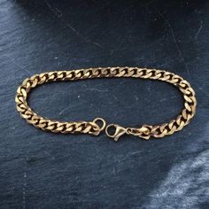 18k gold plated stainless steel curb chain bracelet High Quality 18k Gold plated & water proof ◇ Lengths (inches): 6" (XS)7" (S)8" (M)9" (L)◇Choose between 3mm or 5mm widthSimple staple piece of jewelry perfect for everyday wear !◇ Jewelry comes in a custom Machi Jewelry pouch🎁 gift boxes/wrapping costs an extra £3 which can be added at checkout. Gold Stainless Steel Jubilee Chain Link Bracelet, Stainless Steel Gold Jubilee Chain Link Bracelet, Cuban Link Bracelet In Stainless Steel With Gold Chain, Gold Chain Cuban Link Bracelet In Stainless Steel, Stainless Steel Cuban Link Bracelet With Gold Chain, Gold Stainless Steel Chain Bracelet, Gold Stainless Steel Bracelets With Curb Chain, Gold Cuban Link Bracelet With Adjustable Chain, Gold Cuban Link Bracelet With Chain Detail