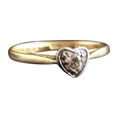 A pretty and romantic vintage Diamond heart ring. Crafted from rich 18kt yellow gold, Diamond and platinum in an Art Deco style. It has a rich 18kt yellow gold band leading up to the front platinum setting, it is designed as a heart with the single brilliant cut diamond set into an illusion setting. It is stamped to the band 18ct and Plat, English make C1960s. This would make a perfect engagement ring or an amazing gift for someone Special. Approx sizes: UK size K½ US size 5⅜ EU / MM 50.27 Weigh 14k Heart Cut Diamond Ring For Valentine's Day, Valentine's Day Yellow Gold Solitaire Diamond Ring, Yellow Gold Solitaire Heart Ring For Valentine's Day, Valentine's Day Solitaire Yellow Gold Heart Ring, Valentine's Day Yellow Gold Solitaire Heart Ring, Classic Gold Heart Ring With Brilliant Cut, Heirloom Diamond Ring For Valentine's Day Anniversary, Heirloom Diamond Ring For Anniversary On Valentine's Day, Heart-shaped Rose Cut Diamond Ring For Anniversary