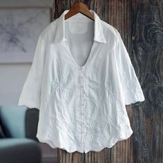 This ultra-feminine weskit-style blouse is the original creation of Antonio Cajahuanca in Peru. Crafted from pure white cotton the shapely blouse features a rounded v-neckline with a collar elbow-length sleeves a scalloped hemline and elegant soutache embroidery. Elegant V-neck Blouse With Broderie Anglaise, Embroidered V-neck Top For Daywear, Summer V-neck Top With Broderie Anglaise, V-neck Broderie Anglaise Blouse For Daywear, V-neck Broderie Anglaise Top, Cotton V-neck Shirt With Floral Embroidery, Embroidered Cotton V-neck Shirt, White V-neck Shirt For Daywear, Daywear V-neck Top With Broderie Anglaise