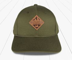 Olive | Trail Hat | Side Casual Baseball Cap With Logo Patch For Camping, Outdoor Trucker Hat With Custom Logo And Curved Brim, Outdoor Trucker Hat With Curved Brim And Custom Logo, Classic Outdoor Baseball Cap With Embroidered Logo, Curved Bill Hat With Custom Logo For Outdoor, Cotton Fitted Hat With Embroidered Logo For Outdoor, Snapback Hat With Logo Patch For Outdoor Activities, Snapback Baseball Cap With Logo Patch For Camping, Snapback Hats With Custom Logo For Outdoor