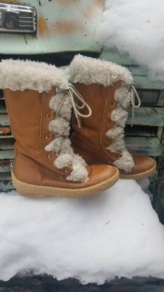 "Rad pair of leather winter boots with comfortable rubber sole. Made by cabela's made in Canada, so you bet they are warm even with faux fur. They are marked size 9 but id suggest a 8 to 8.5 unless you run a smaller 9. Decent shape for their age but they do have some scratched up spots on one toe and here and there elsewhere in the leather. These still have many years of wear to go in them. Length 10 1/4 Width 3 3/4 Heel 1 1/4\" Height 12.5\"" Leather Winter Boots, Fawn Colour, Winter Leather Boots, Floral Cotton Dress, Rust Dress, Caramel Color, Winter Snow Boots, Rain And Snow Boots, Boot Shoes Women