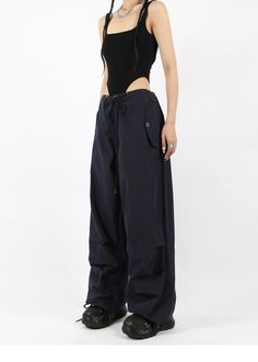 There’s a new trend in town, and it’s nightcity clothing’s Button Pocket Oversized Parachute Pants. These comfy, lightweight pants look great when paired with a crop top or graphic tee and sneakers. With a drawstring waistline, these pants are comfortable and secure, and the oversized fit gives them an effortless and chill look. Add these pants to your wardrobe, and you’ll never have a dull moment — you’ll always be ready for an impromptu night out, no matter how casual it might be.
Gender: Wome Trendy Pants With Cargo Pockets For Night Out, Urban Summer Bottoms, Trendy Cargo Pocket Pants For Night Out, Edgy Baggy Summer Pants, Urban High-waist Parachute Pants For Summer, Urban High Waist Parachute Pants For Summer, High-waisted Cargo Pants For Night Out, High Waist Cargo Pants For Summer Night Out, Trendy Wide Leg Cargo Pants For Night Out