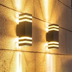 three lights on the side of a building