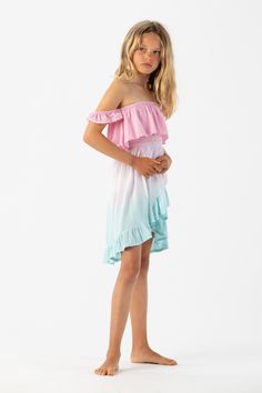 The Kids Daisy Dress was created with family adventure in mind. The bodice of this dress is adorned with intricate ruffle trim, adding dimension and movement to the top while cascading into a high-low hemline. The ruffle trim creates a charming and whimsical effect, perfect for matching with Mom in this all new style for the season. Details: 100% Rayon Hand Wash in Cold Water and Lay Flat to Dry Features: Unlined, Smocked bodice, Ruffle fabric overlay, Off the shoulder flutter sleeves, High-low Casual Ruffled Twirl Dress For Spring, Multicolor Tiered Dress With Ruffled Skirt, Multicolor Tiered Skirt Dress With Ruffle Hem, Pink Flowy Tiered Dress With Ruffles, Flowy Pink Tiered Dress With Ruffles, Pink Ruffled Twirl Dress For Beach, Multicolor Ruffle Dress For Summer, Pink Summer Twirl Dress With Ruffles, Pink Beach Twirl Dress With Ruffles