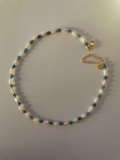 🌟 OUR DELICATE SIREN FRESHWATER PEARL NECKLACE WITH UNIQUE APATITE 🌟 HANDMADE WITH LOVE The small, delicate freshwater pearls are the focus of this elegant necklace, giving it an aura of timeless elegance and grace. The faceted apatite beads set a unique accent and represent self-confidence, communication and inspiration. The gold beads and clasp are plated with 18k gold to ensure durability and elegance. WHY OUR SIREN FRESHWATER PEARL NECKLACE WITH APATITE? ✨ Unique design of the highest qual Cheap Beaded Pearl Necklace For Beach, Necklace Handmade Ideas, Pearl Necklace Ideas, Beads Necklace Design, Unique Jewelry Inspiration, Small Beaded Necklace, Siren Necklace, Handmade Necklace Designs, Small Pearl Necklace