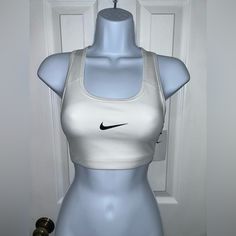 Brand:Nike Color:White With A Black Nike Sign Size:Small Condition:Nwt Fitted White Sports Bra With Built-in Bra, White Activewear With Built-in Bra For Training, White Sporty Activewear With Built-in Bra, White Sports Bra For Gym With Medium Support, White Sports Bra With Medium Support For Workout, White Sports Bra With Built-in Bra For Gym, White Racerback Sports Bra With Medium Bust Support, White Fitted Sports Bra With Medium Support, White Medium Support Sports Bra For Workout