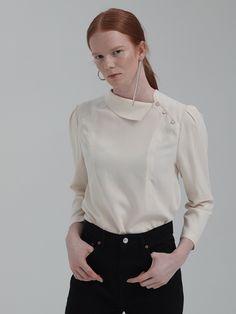 Editor's NotesUnique design asymmetrical detail collar puff sleeve design blouse top. This has a casual and classy mood that is great to style in a casual and formal way with various of outfits.- Unique detail pointed blouse top- Chic and feminine silhouette when worn- Natural drape like silhouette design wear- Great to style in various of luxurious waysMeasurements(in.)One Size (XS-M)- Total Length: 23.43 in.- Shoulder: 14.80 in.- Chest: 37.13 in.- Hem: 40.31& Elegant Structured Blouse For Work, Elegant Formal Blouse With Structured Shoulders, Elegant Structured Evening Tops, Timeless Collared Tops For Fall, Spring Business Casual Blouse With Collar, Business Casual Spring Blouse With Collar, Chic Structured Formal Tops, Chic Collared Blouse For Work, Chic Formal Blouse With Structured Shoulders