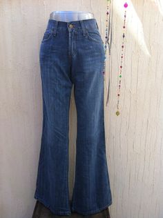 A beautiful vintage bell botom jeans Lois perfect for a boho festival  look with your favourite boots or platforms and a hat.Made in Spain in early 90s,is in excelent vintage condition(never used;new ítem,old stock). Everything at VintageBeachHut has been carefully washed or dry cleaned and it is ready to wear.    Measurements are taken flat in inches (and centimetres); bust and waist already doubled: Waist:26,77 inches(68 cm) Hips:16,53 inches (42 cm) Lenght:42,91 inches(109 cm) Inseam:32,67 in Spring High Waist Bohemian Jeans, Bohemian High Waist Jeans For Spring, Spring Bohemian High Waist Jeans, Bohemian Fitted Wide Leg Flares, Spring Bohemian Wide Leg Flare Jeans, Fitted Bohemian Flares For Spring, Wide Leg Summer Festival Jeans, Summer Festival Wide Leg Jeans, Wide Leg Jeans For Summer Festivals