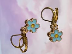 1 pair of hoops Trendy Hoop Earrings With Flower Charm For Spring, Trendy Gold Hoop Earrings With Flower Charm, Gold Flower-shaped Nickel-free Hoop Earrings, Handmade Gold Hoop Earrings For Spring, Trendy Gold Flower Charm Earrings, Spring Hoop Earrings With Flower Charm, Trendy Gold Flower Hoop Earrings, Spring Hoop Earrings With Flower Charm As Gift, Gold Hypoallergenic Flower Hoop Earrings