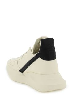 Geth Runner sneakers by Rick Owens with soft smooth leather upper characterized by the contrasting heel tab. Grosgrain loop tab on the tongue and padded back. Leather lining with removable insole and maxi rubber sole with squared toe and bulging back. Size Info IT Color Detail Mixed colours Made In Italia Material 100% calf leather Season One spring Season Two summer Product shoes Brand Rick Owens Size And Fit Heel Height = 5 cm Modern High-top Sneakers With Contrasting Heel For Streetwear, Modern Sneakers With Textured Sole For Jogging, Modern Textured Sole Jogging Sneakers, Modern Chunky Sneakers For Jogging With Abzorb Midsole, Modern Custom Sneakers For Jogging With Translucent Outsole, Jogging High-top Sneakers With Contrast Sole, Modern High-top Sneakers With Rubber Sole For Jogging, Sporty Platform Sneakers With Contrasting Heel For Streetwear, Modern Custom Sneakers With Boost Midsole For Jogging