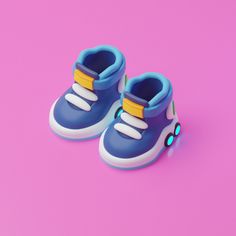 a pair of blue shoes on a pink background