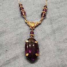 Absolutely Beautiful Deep Purple And Gold Necklace Featuring A Large Pendant Handmade In Rhode Island Every Piece Is Unique As It Is Made With Vintage Glass Never Worn, In Box Purple Oval Party Jewelry, Purple Oval Jewelry For Party, Formal Purple Pendant Necklace, Elegant Purple Gold-plated Jewelry, Bohemian Amethyst Gold Necklace, Vintage Amethyst Necklace In Yellow Gold, Vintage Amethyst Yellow Gold Necklace, Vintage Purple Pendant Necklace, Crystal Goddess